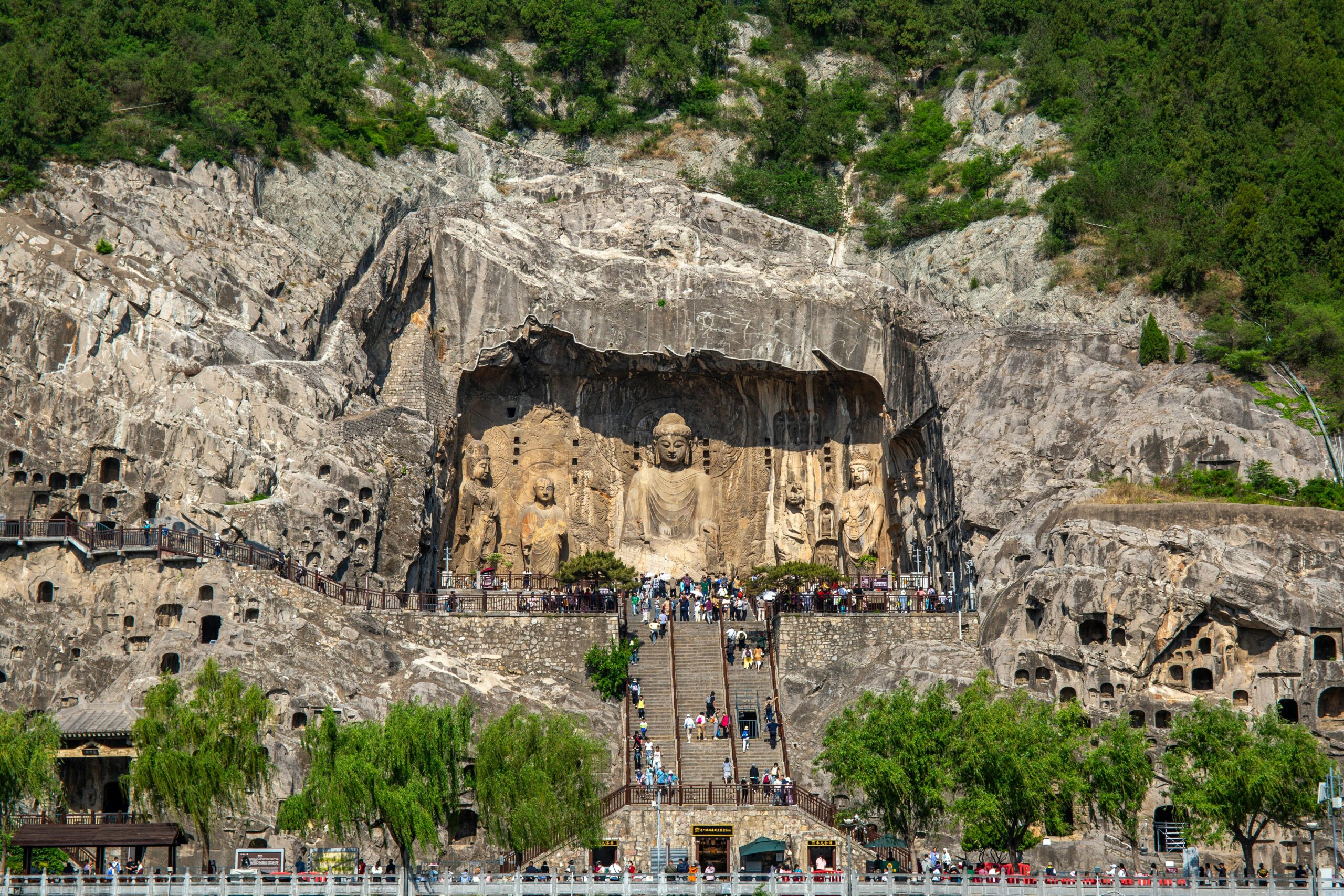 Breathtaking view of the Longmen Grottoes, showcasing ancient Buddha carvings in Luoyang, China.