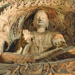 Legacy 1 Explore the serene Buddha sculpture in China's historic Yungang Grottoes.